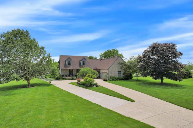 3171 Orders Rd, Grove City, OH 43123 - new england style home with a front lawn, stone siding, a garage, and concrete driveway
