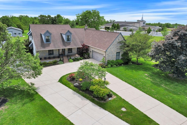 3171 Orders Rd, Grove City, OH 43123 - cape cod house featuring stone siding, a porch, driveway, a front yard, and an attached garage