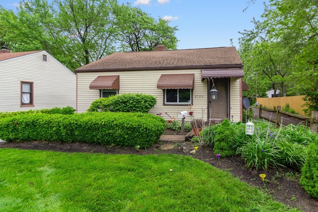 2720 Audubon Rd, Columbus, OH 43211 - view of front of home featuring a chimney and a shingled roof