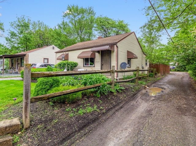 2720 Audubon Rd, Columbus, OH 43211 - view of front of house featuring a chimney and roof with shingles