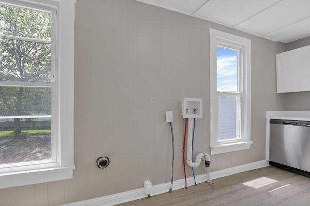 1120 8th Ave, Lancaster, OH 43130 - washroom featuring light wood-style floors, plenty of natural light, baseboards, and washer hookup