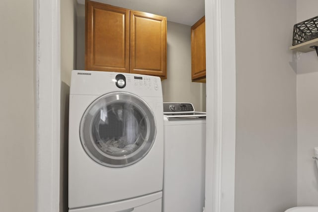 402 W St, Groveport, OH 43125 - laundry area featuring cabinet space and washing machine and dryer