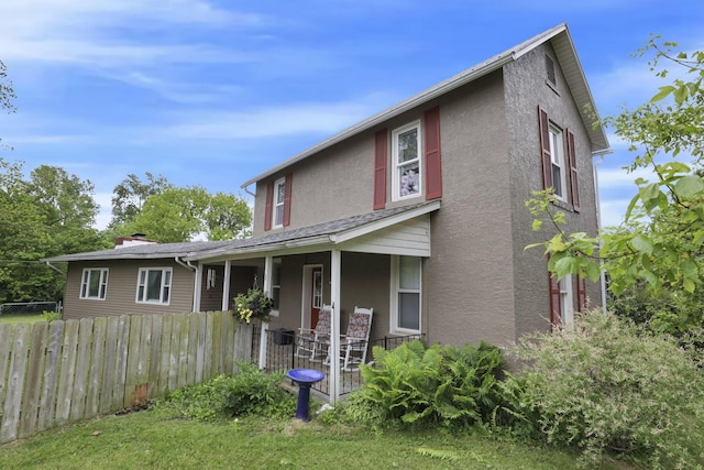 402 W St, Groveport, OH 43125 - view of front of property featuring stucco siding and covered porch