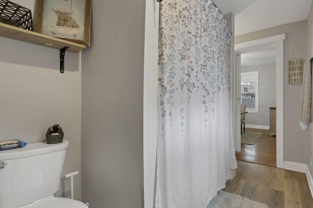 402 W St, Groveport, OH 43125 - full bathroom with toilet, wood finished floors, baseboards, and a shower with shower curtain