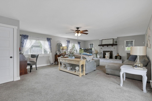 402 W St, Groveport, OH 43125 - living room featuring a ceiling fan, carpet, baseboards, and a fireplace