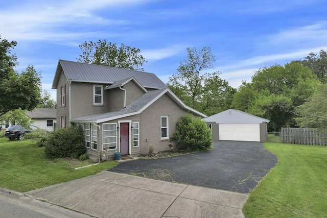 402 W St, Groveport, OH 43125 - traditional-style home featuring a detached garage, an outbuilding, stucco siding, and metal roof