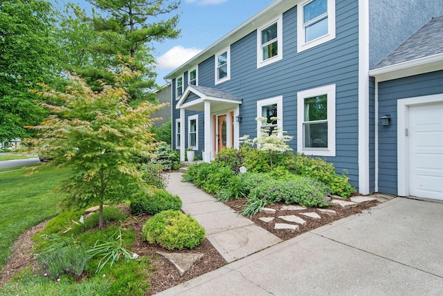 1055 Arcaro Dr, Columbus, OH 43230 - view of front of home with a garage and a shingled roof