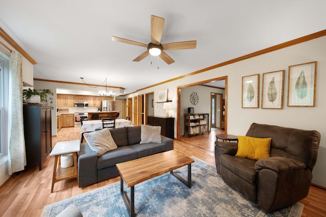 1055 Arcaro Dr, Columbus, OH 43230 - living area with light wood-style flooring, a chandelier, crown molding, and ceiling fan