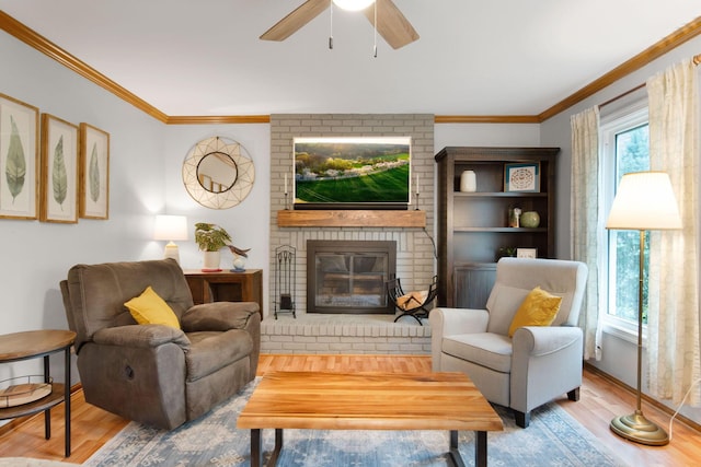 1055 Arcaro Dr, Columbus, OH 43230 - living area with wood finished floors, a fireplace, ornamental molding, and ceiling fan