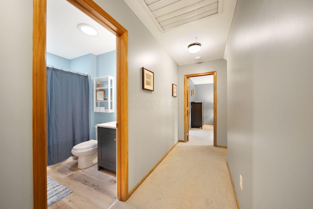 1055 Arcaro Dr, Columbus, OH 43230 - corridor with baseboards and attic access
