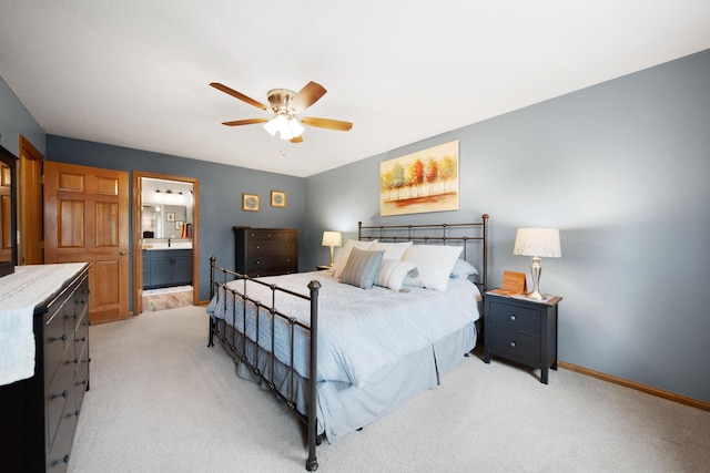 1055 Arcaro Dr, Columbus, OH 43230 - bedroom featuring light carpet, baseboards, ceiling fan, and ensuite bath