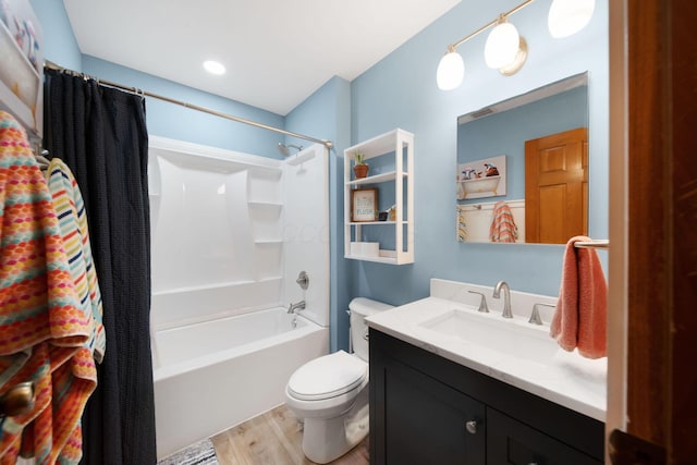 1055 Arcaro Dr, Columbus, OH 43230 - full bath featuring shower / bath combo with shower curtain, wood finished floors, vanity, and toilet
