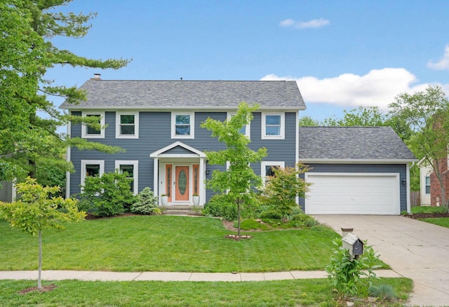 1055 Arcaro Dr, Columbus, OH 43230 - colonial inspired home with a garage, driveway, a front lawn, a chimney, and a shingled roof