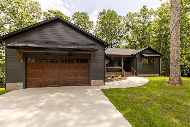 21650 Lake Rd, Glouster, OH 45732 - view of front of house with a porch, a front lawn, a garage, and driveway