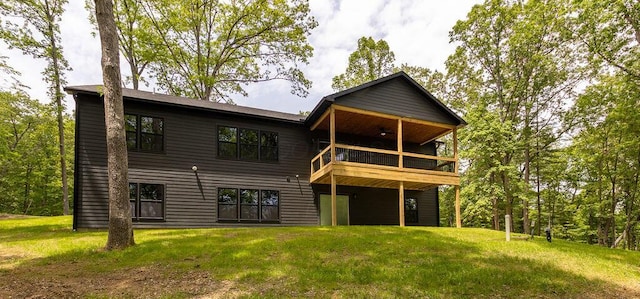 21650 Lake Rd, Glouster, OH 45732 - rear view of property featuring ceiling fan, a yard, and a deck