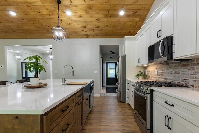 21650 Lake Rd, Glouster, OH 45732 - kitchen featuring appliances with stainless steel finishes, wooden ceiling, a sink, white cabinetry, and dark wood-type flooring