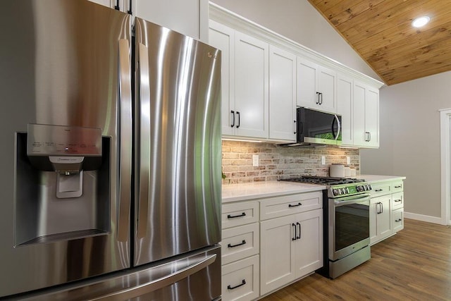 21650 Lake Rd, Glouster, OH 45732 - kitchen featuring appliances with stainless steel finishes, vaulted ceiling, wood ceiling, light countertops, and backsplash