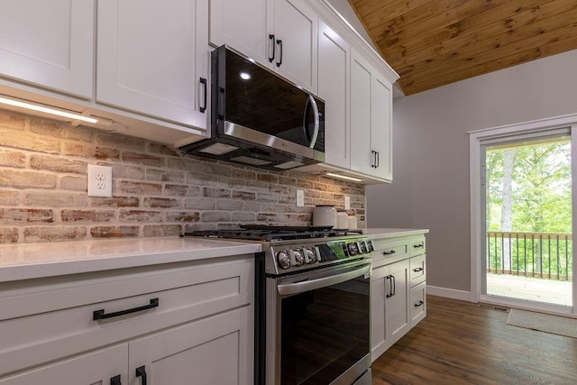 21650 Lake Rd, Glouster, OH 45732 - kitchen featuring appliances with stainless steel finishes, decorative backsplash, light countertops, dark wood-style flooring, and white cabinetry