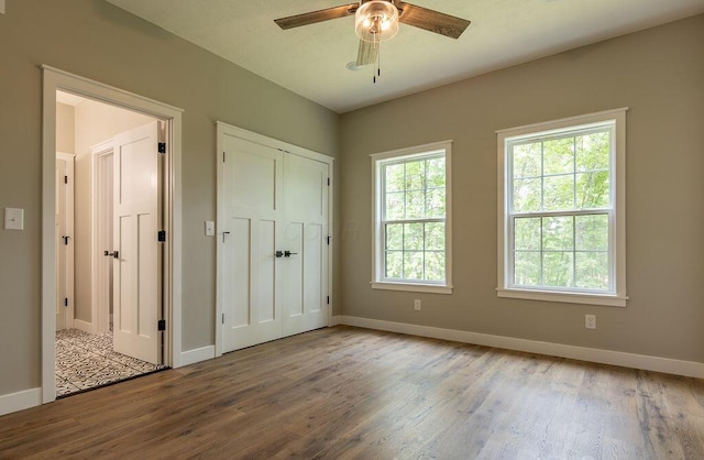 21650 Lake Rd, Glouster, OH 45732 - unfurnished bedroom featuring wood finished floors, baseboards, and a closet