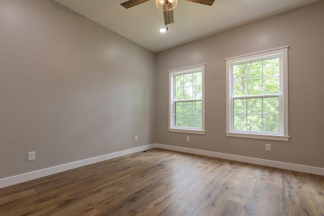 21650 Lake Rd, Glouster, OH 45732 - empty room with baseboards, ceiling fan, wood finished floors, and vaulted ceiling