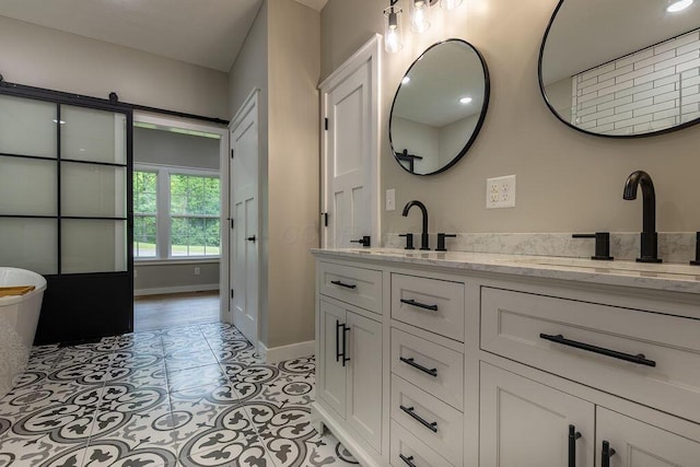 21650 Lake Rd, Glouster, OH 45732 - full bath featuring double vanity, baseboards, tile patterned floors, and a freestanding bath