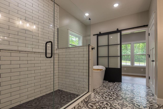 21650 Lake Rd, Glouster, OH 45732 - bathroom with a stall shower, recessed lighting, and baseboards