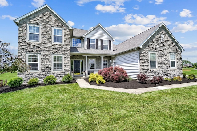 401 Warrenpoint Ln, Pataskala, OH 43062 - view of front of house featuring stone siding, covered porch, a front yard, and roof with shingles