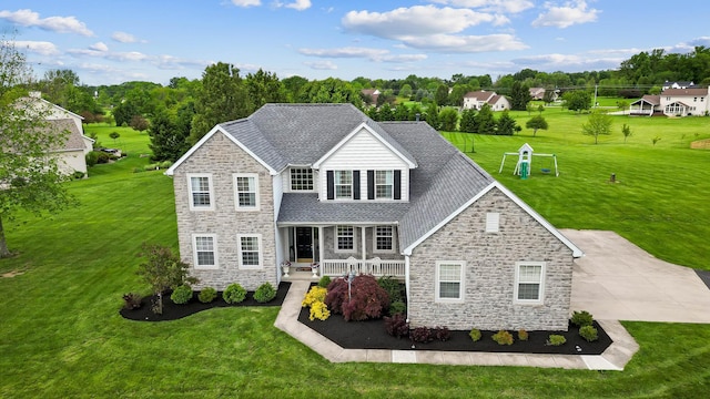 401 Warrenpoint Ln, Pataskala, OH 43062 - traditional home featuring stone siding, a front yard, covered porch, and roof with shingles