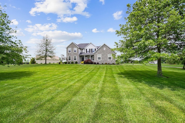401 Warrenpoint Ln, Pataskala, OH 43062 - view of front of home featuring stone siding and a front lawn