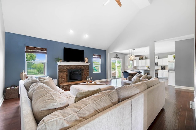 401 Warrenpoint Ln, Pataskala, OH 43062 - living room with high vaulted ceiling, baseboards, dark wood-style floors, a fireplace, and recessed lighting