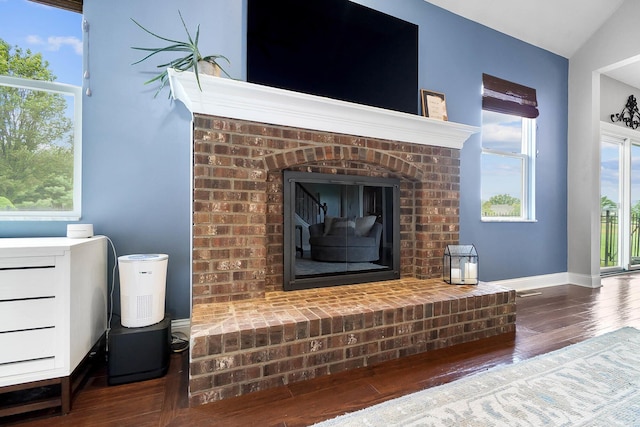 401 Warrenpoint Ln, Pataskala, OH 43062 - detailed view of wood finished floors, a brick fireplace, and baseboards