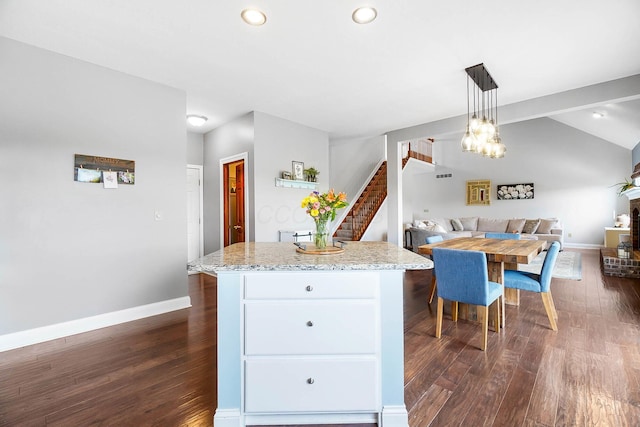 401 Warrenpoint Ln, Pataskala, OH 43062 - kitchen featuring dark wood finished floors, a center island, decorative light fixtures, baseboards, and lofted ceiling