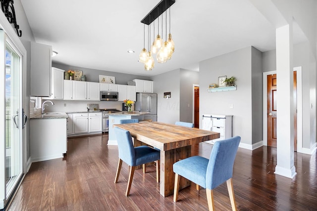 401 Warrenpoint Ln, Pataskala, OH 43062 - dining space featuring dark wood finished floors, baseboards, a chandelier, and recessed lighting