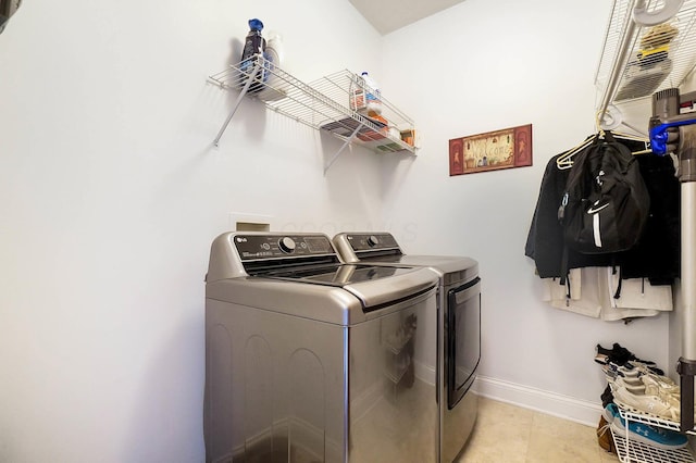 401 Warrenpoint Ln, Pataskala, OH 43062 - laundry area with washing machine and dryer, baseboards, and light tile patterned floors