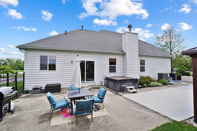 401 Warrenpoint Ln, Pataskala, OH 43062 - rear view of property with a hot tub, a patio, roof with shingles, and a chimney