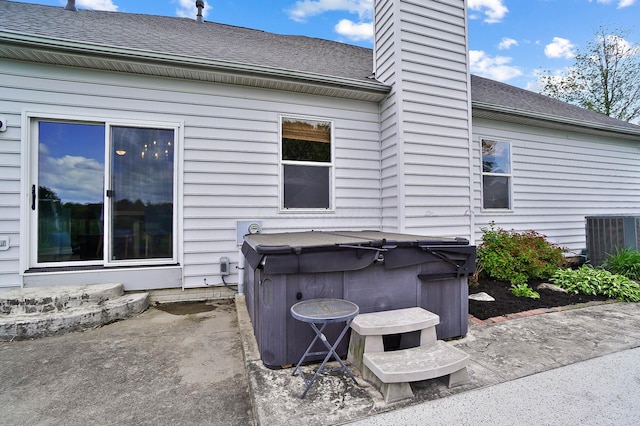 401 Warrenpoint Ln, Pataskala, OH 43062 - view of patio / terrace with a hot tub and central air condition unit