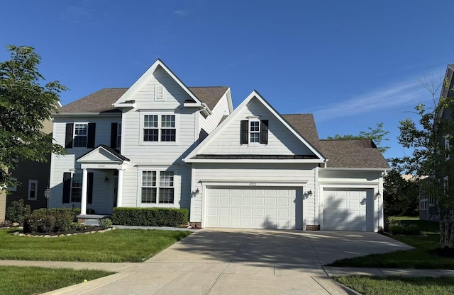 6512 Dicesare Loop, Dublin, OH 43016 - traditional-style home with driveway, a front lawn, an attached garage, and roof with shingles