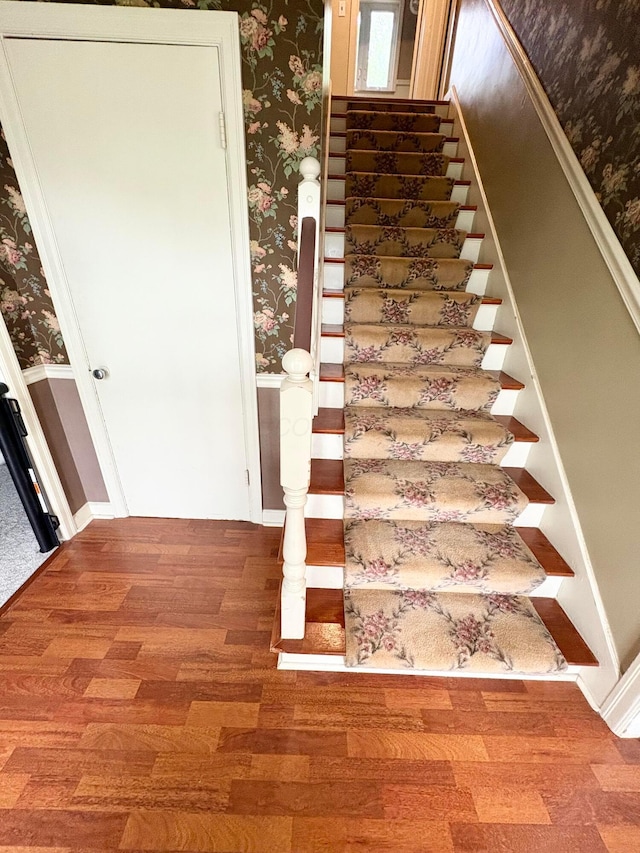 2010 S Main St, Findlay, OH 45840 - staircase featuring wallpapered walls and wood finished floors