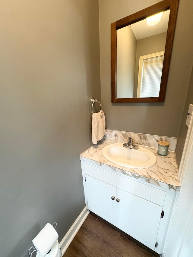 2010 S Main St, Findlay, OH 45840 - bathroom featuring vanity, wood finished floors, and baseboards