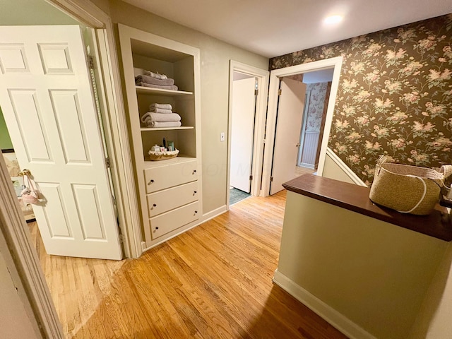 2010 S Main St, Findlay, OH 45840 - hallway featuring light wood-style flooring and wallpapered walls