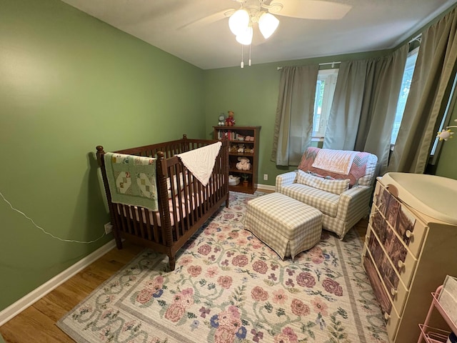 2010 S Main St, Findlay, OH 45840 - bedroom featuring wood finished floors, baseboards, and a ceiling fan