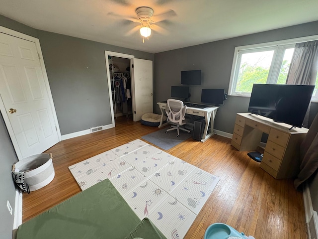 2010 S Main St, Findlay, OH 45840 - home office with a ceiling fan, light wood finished floors, and baseboards
