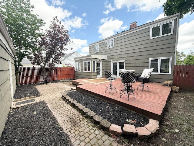 2010 S Main St, Findlay, OH 45840 - back of property featuring a wooden deck, a fenced backyard, and a chimney