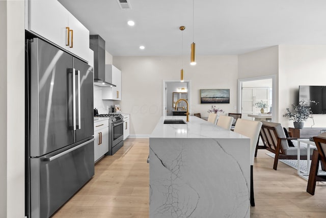 6640 Mooney St Unit 402, Dublin, OH 43017 - kitchen with stainless steel appliances, a sink, modern cabinets, white cabinetry, and recessed lighting