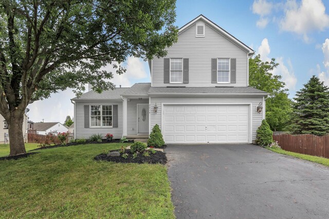 2016 Sondra Ln, Grove City, OH 43123 - traditional home with asphalt driveway and an attached garage