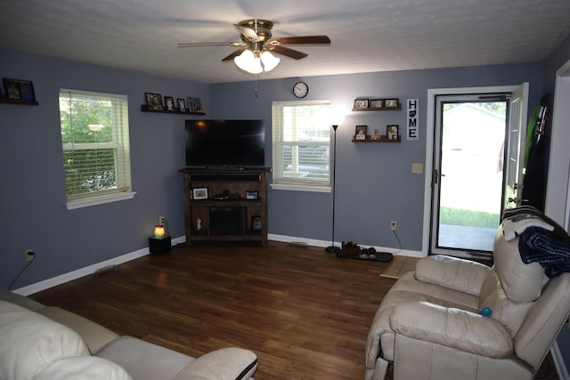 1131 Campbell St, Washington Court House, OH 43160 - living area featuring a ceiling fan, wood finished floors, and baseboards