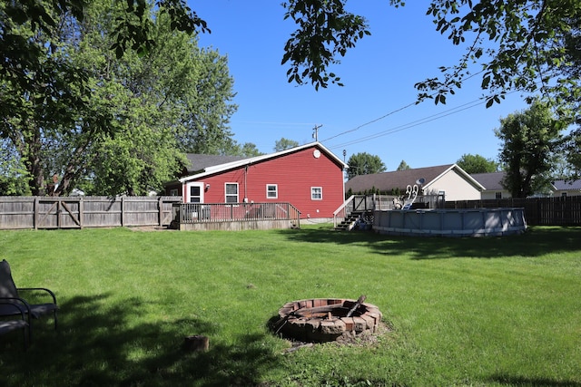1131 Campbell St, Washington Court House, OH 43160 - view of yard featuring a deck and a fire pit