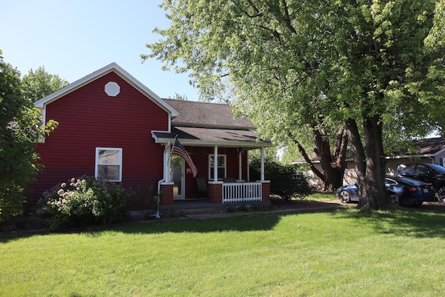 1131 Campbell St, Washington Court House, OH 43160 - view of front of property featuring a porch, a front yard, and a shingled roof