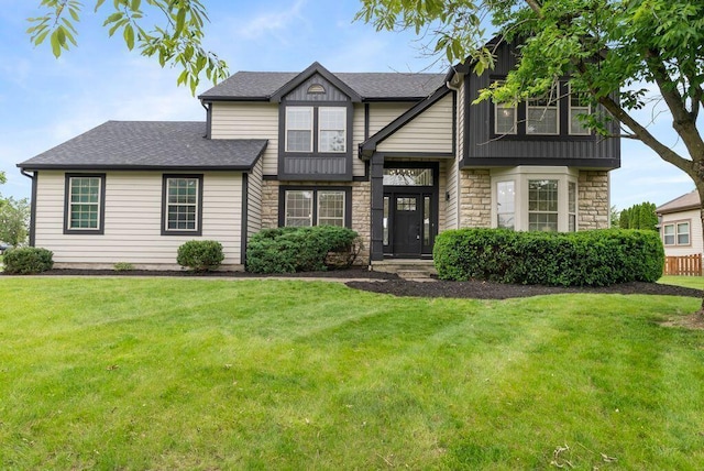 6377 Dietz Dr, Canal Winchester, OH 43110 - view of front facade with stone siding and a front yard