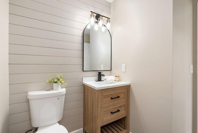 6377 Dietz Dr, Canal Winchester, OH 43110 - half bath featuring vanity, toilet, and wood walls
